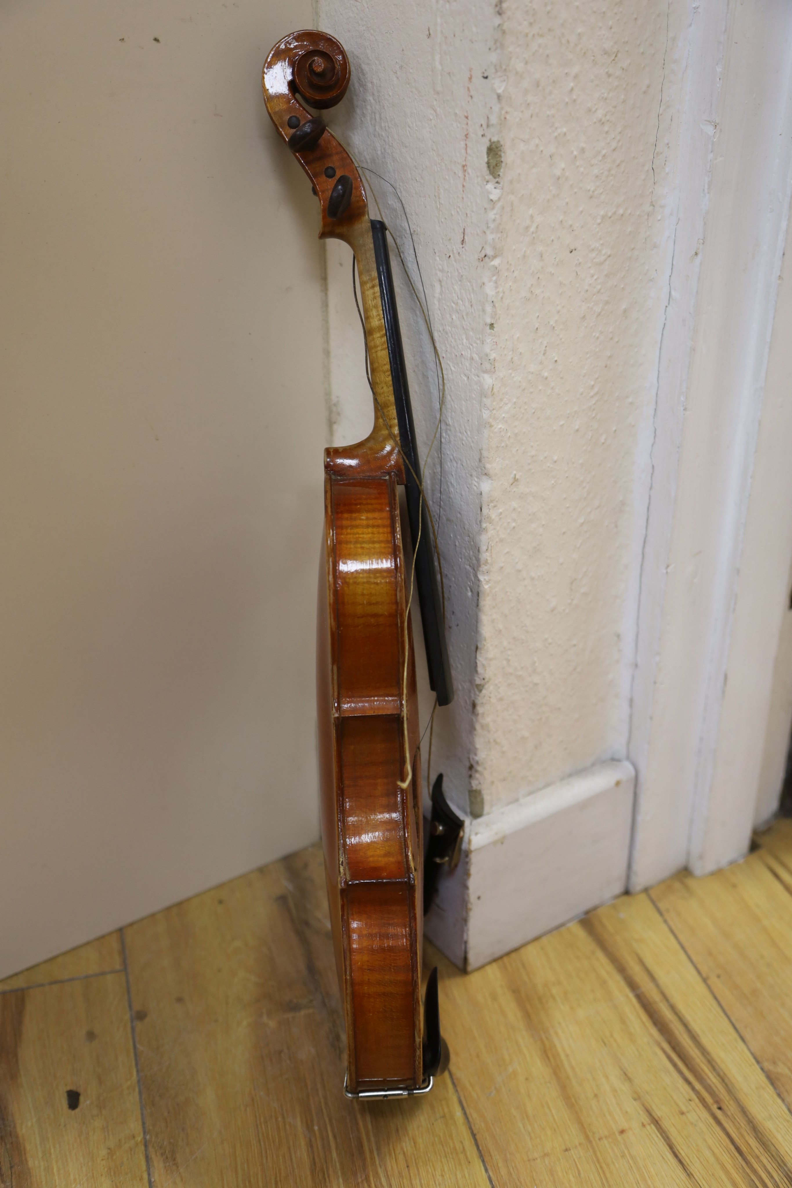 A Stradivarius copy violin and two bows and another bow, both cased, backs 33cm and 30cm